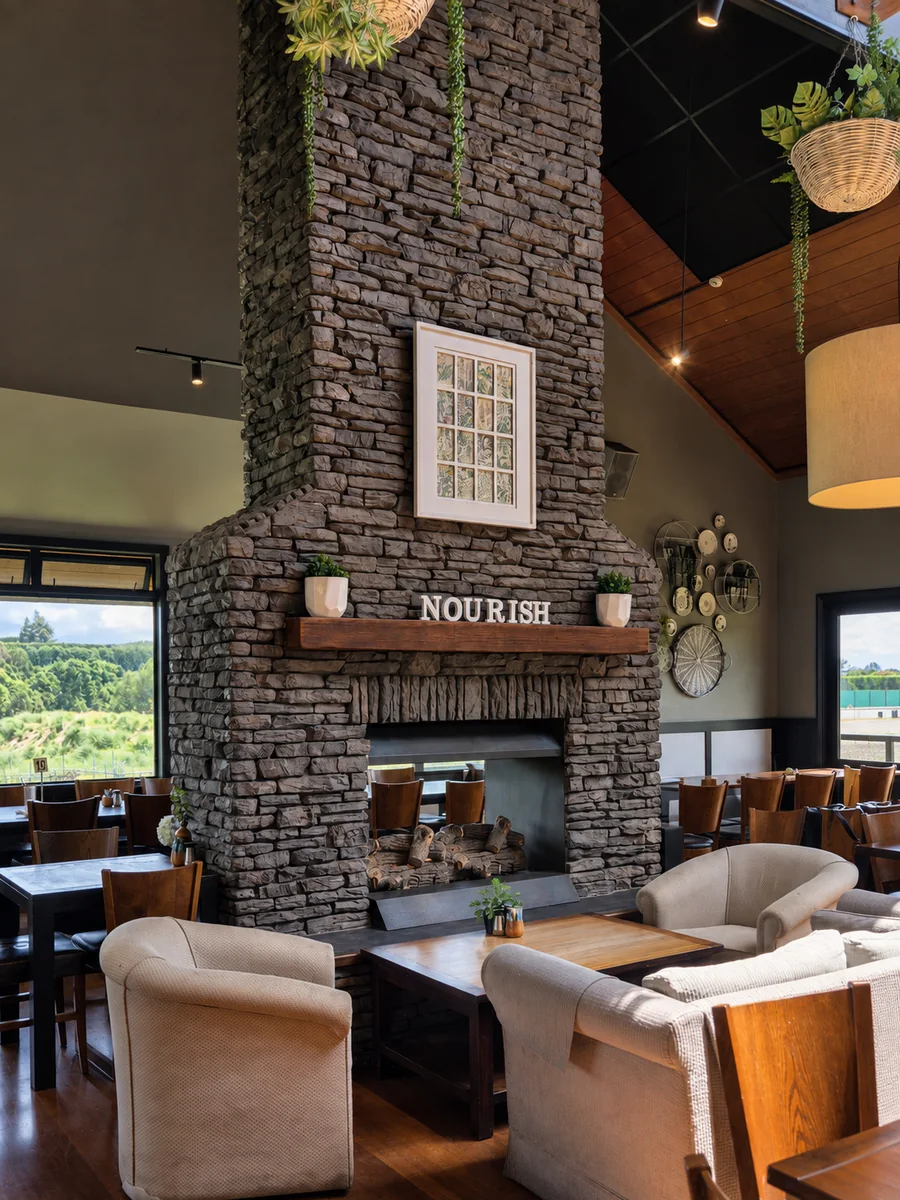 Stone fireplace and warm seating inside Nourish Cafe