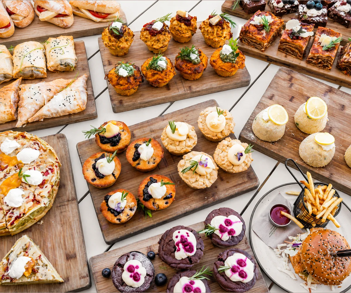 A catering spread prepared with savoury and sweet food